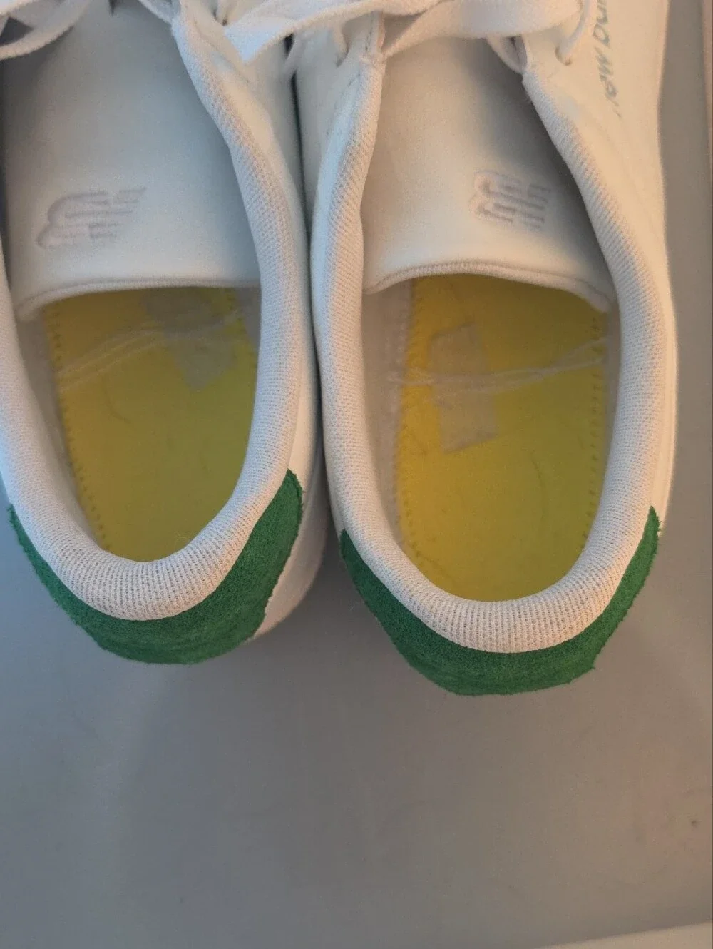 New Balance White Sneakers with Green Heel Accent